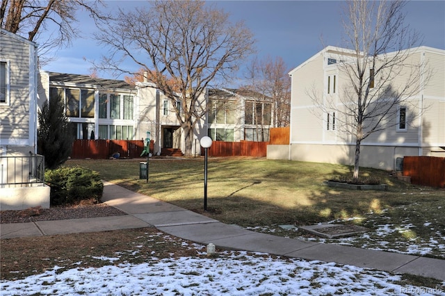 view of home's community with a lawn