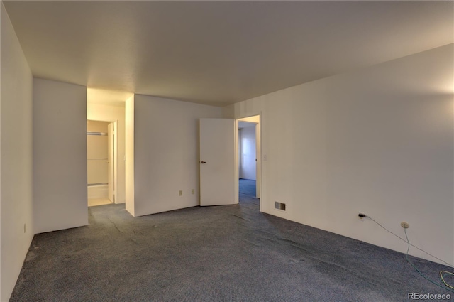 1050 S Monaco Pkwy Unit 88, Denver, CO 80224 - unfurnished room featuring dark carpet
