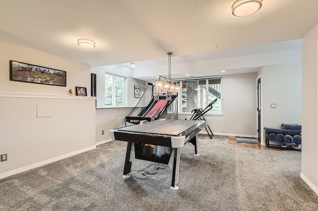 989 Graland Pl, Highlands Ranch, CO 80126 - rec room featuring carpet flooring, baseboards, and a textured ceiling