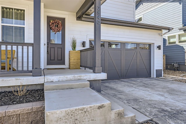 2840 E 102nd Pl, Thornton, CO 80229 - property entrance with a porch, an attached garage, and concrete driveway