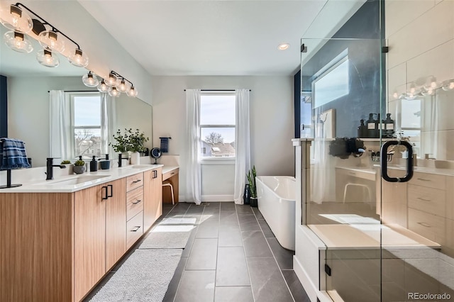 2840 E 102nd Pl, Thornton, CO 80229 - full bath featuring plenty of natural light, vanity, a freestanding bath, and a shower stall