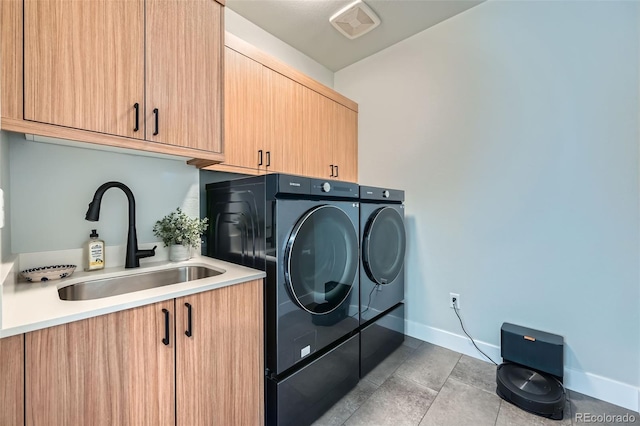 2840 E 102nd Pl, Thornton, CO 80229 - washroom featuring cabinet space, washing machine and dryer, and light tile patterned flooring