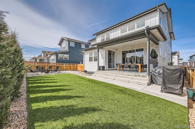 2840 E 102nd Pl, Thornton, CO 80229 - back of house with a patio, a fenced backyard, and outdoor dining area