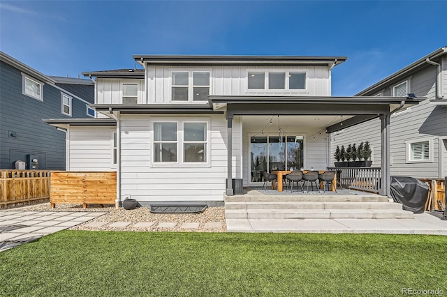 2840 E 102nd Pl, Thornton, CO 80229 - back of property with board and batten siding and a patio