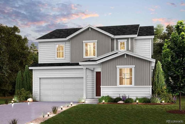 view of front of house with driveway, an attached garage, a front yard, and a shingled roof