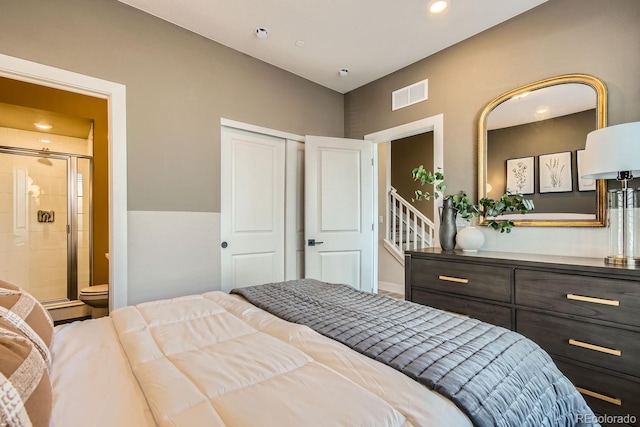 bedroom with a closet and connected bathroom