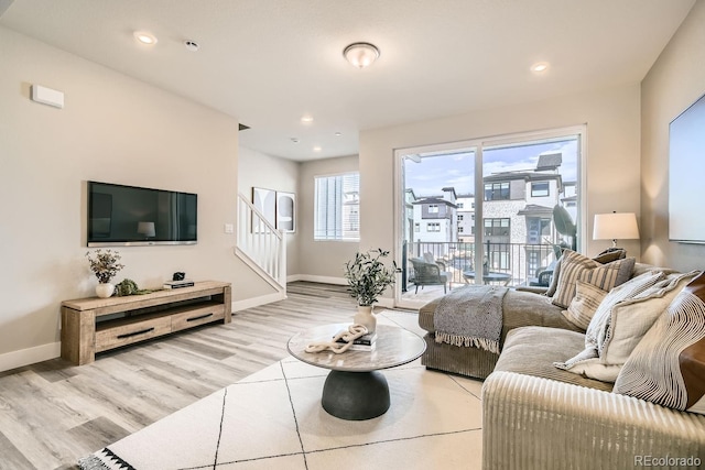 living room with light hardwood / wood-style flooring