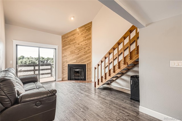 303 W Lehow Ave Unit 22, Englewood, CO 80110 - living room featuring stairs, a fireplace, and wood finished floors