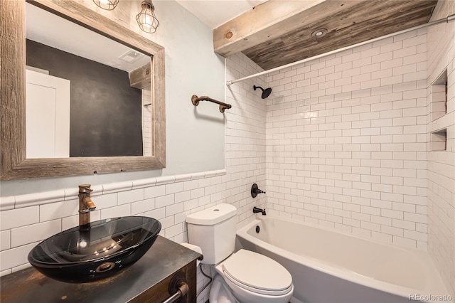 303 W Lehow Ave Unit 22, Englewood, CO 80110 - full bath featuring tile walls,  shower combination, vanity, and wainscoting