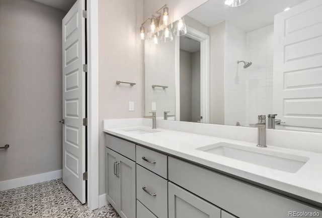 1744 Barefoot Dr, Windsor, CO 80550 - bathroom featuring double vanity, tiled shower, and tile patterned floors