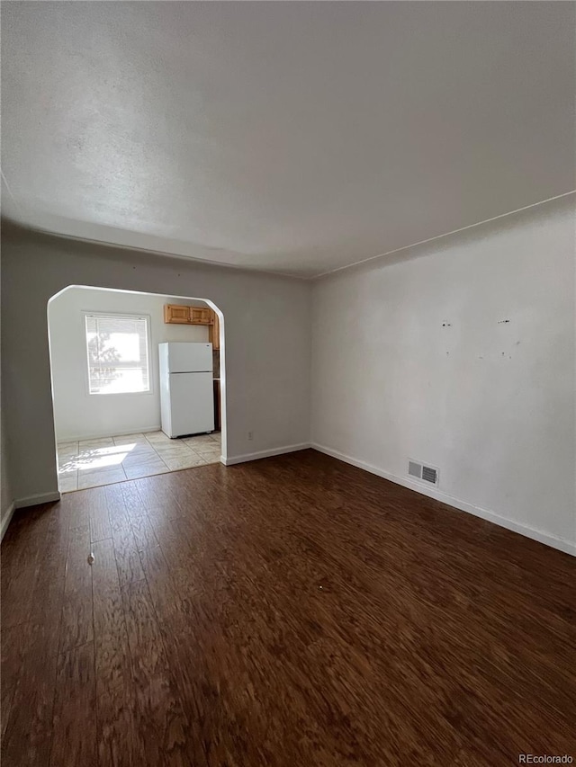 unfurnished living room with light hardwood / wood-style floors