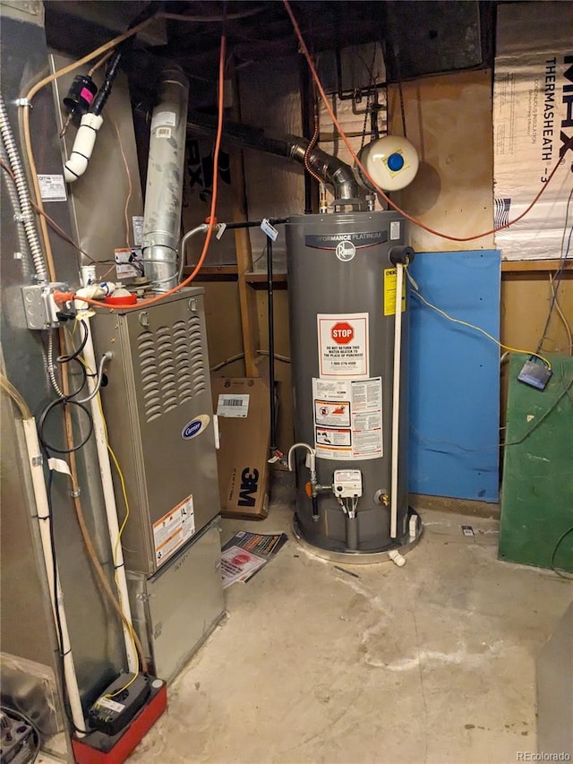 utility room featuring gas water heater