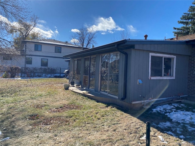 view of home's exterior featuring a sunroom