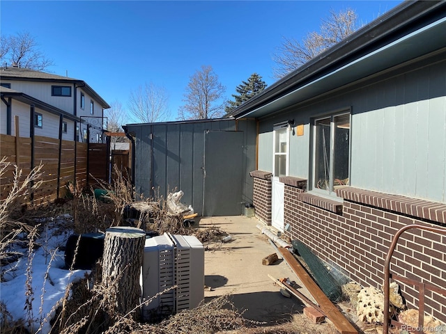 view of home's exterior with fence