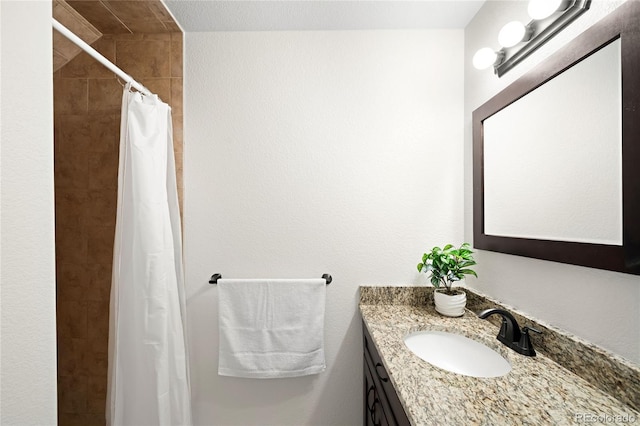 3402 N Clayton St, Denver, CO 80205 - bathroom featuring vanity and tiled shower