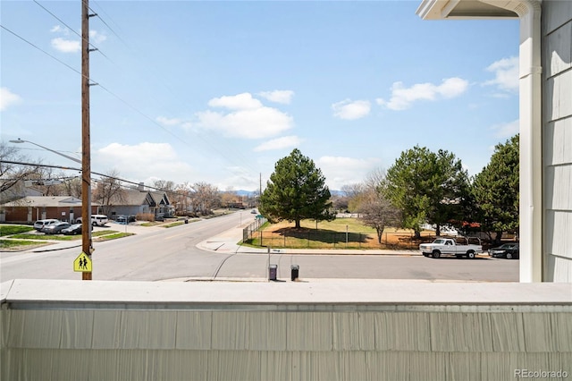 3402 N Clayton St, Denver, CO 80205 - view of asphalt street featuring sidewalks, street lighting, curbs, and a residential view