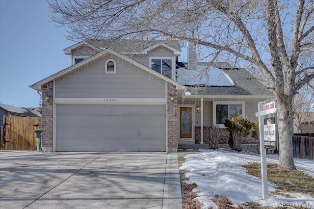 view of front of property featuring a garage