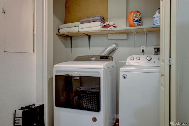 laundry room with separate washer and dryer