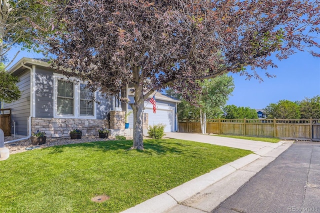 12 Apache Plume St, Brighton, CO 80601 - obstructed view of property with stone siding, a garage, and driveway