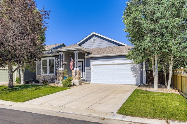 12 Apache Plume St, Brighton, CO 80601 - ranch-style house featuring a garage, driveway, and roof with shingles