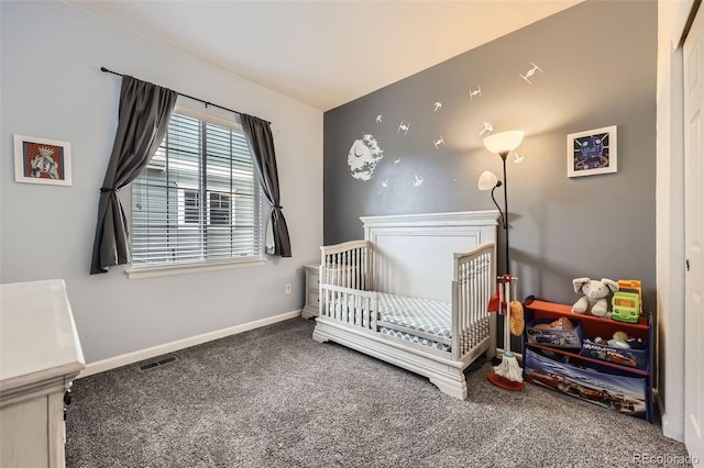 12 Apache Plume St, Brighton, CO 80601 - carpeted bedroom with a nursery area and baseboards