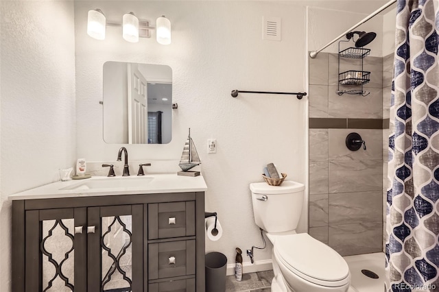 12 Apache Plume St, Brighton, CO 80601 - bathroom featuring vanity and a tile shower