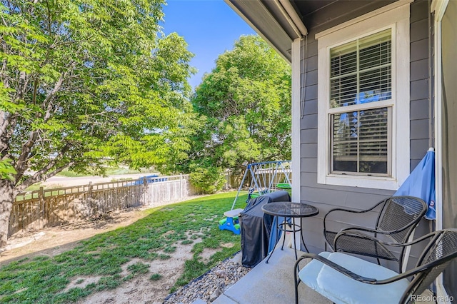 12 Apache Plume St, Brighton, CO 80601 - fenced backyard featuring a playground