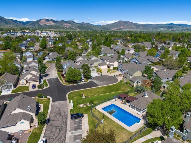 5006 S Nelson St Unit B, Littleton, CO 80127 - view of property location featuring a mountainous background, a pool, and nearby suburban area