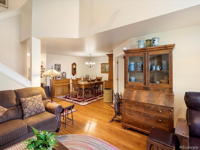5006 S Nelson St Unit B, Littleton, CO 80127 - living area with a chandelier and light wood-type flooring