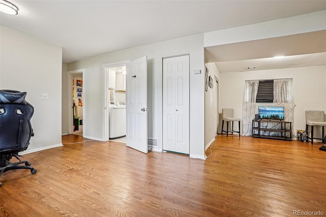 1733 S Nucla St, Aurora, CO 80017 - office featuring washer / clothes dryer and wood finished floors