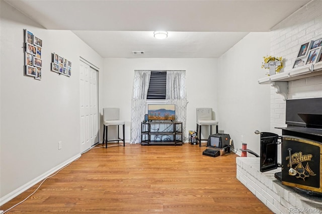 1733 S Nucla St, Aurora, CO 80017 - living area featuring wood finished floors and a fireplace