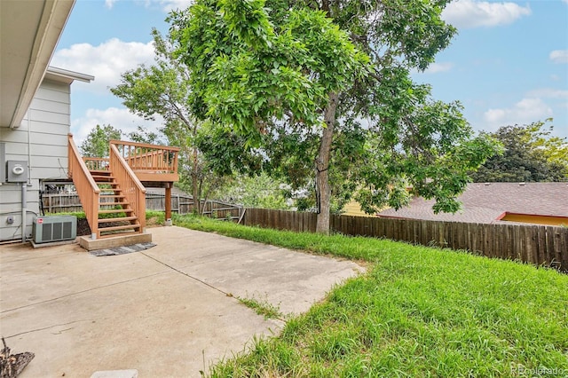 1733 S Nucla St, Aurora, CO 80017 - fenced backyard featuring stairs, a patio, and a wooden deck