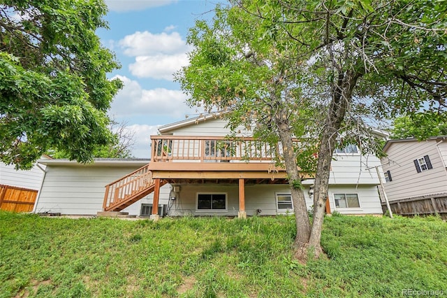 1733 S Nucla St, Aurora, CO 80017 - rear view of house featuring stairway and a wooden deck