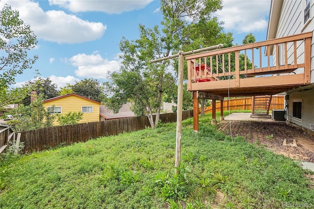 1733 S Nucla St, Aurora, CO 80017 - fenced backyard with a wooden deck, a patio, and stairs