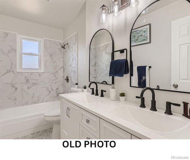 1733 S Nucla St, Aurora, CO 80017 - bathroom featuring tub / shower combination and double vanity