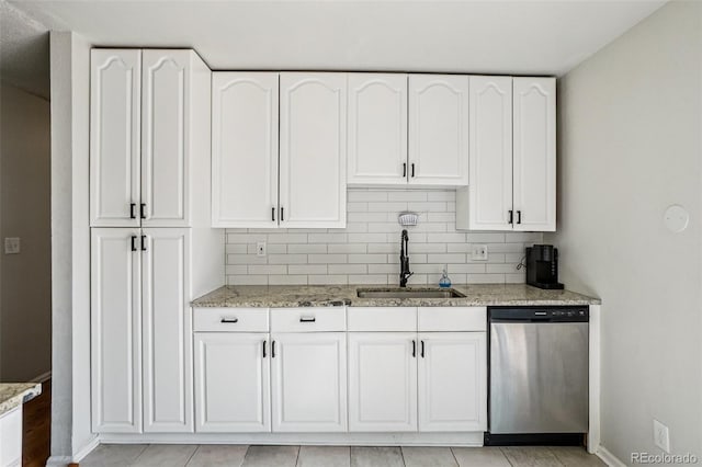 1733 S Nucla St, Aurora, CO 80017 - kitchen featuring stainless steel dishwasher, light stone countertops, and white cabinetry