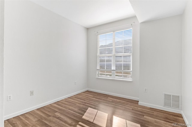 empty room featuring hardwood / wood-style floors