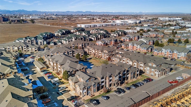 birds eye view of property with a mountain view