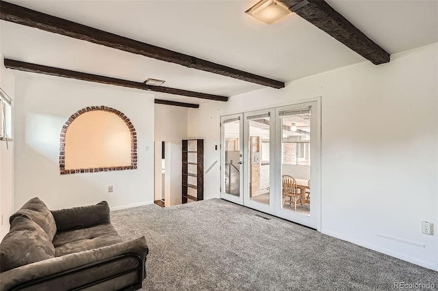 2692 S Osceola St, Denver, CO 80219 - carpeted living room with healthy amount of natural light and beam ceiling