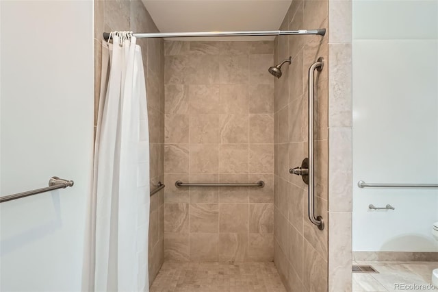 2692 S Osceola St, Denver, CO 80219 - full bathroom with a tile shower and toilet