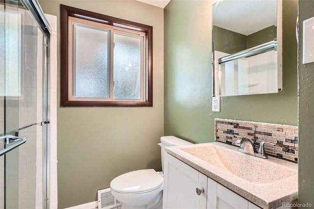 2692 S Osceola St, Denver, CO 80219 - bathroom featuring tasteful backsplash, a stall shower, and vanity