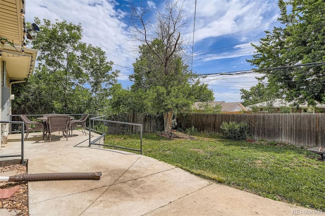 2692 S Osceola St, Denver, CO 80219 - fenced backyard with outdoor dining space and a patio