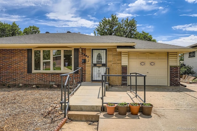 2692 S Osceola St, Denver, CO 80219 - ranch-style home featuring brick siding, an attached garage, driveway, and a shingled roof