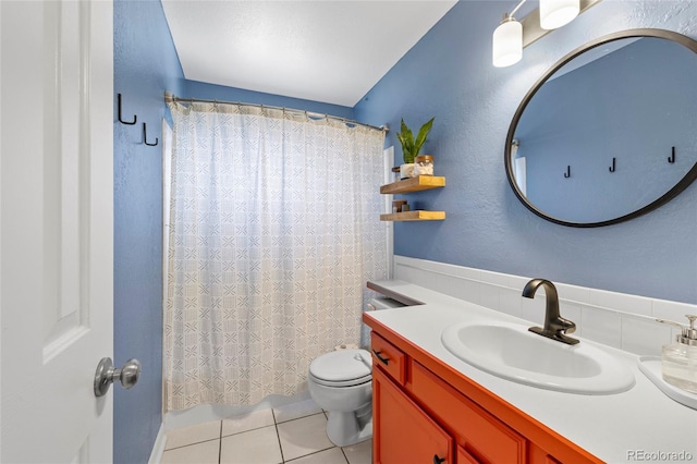 full bathroom with toilet, tile patterned floors, shower / tub combo, and vanity