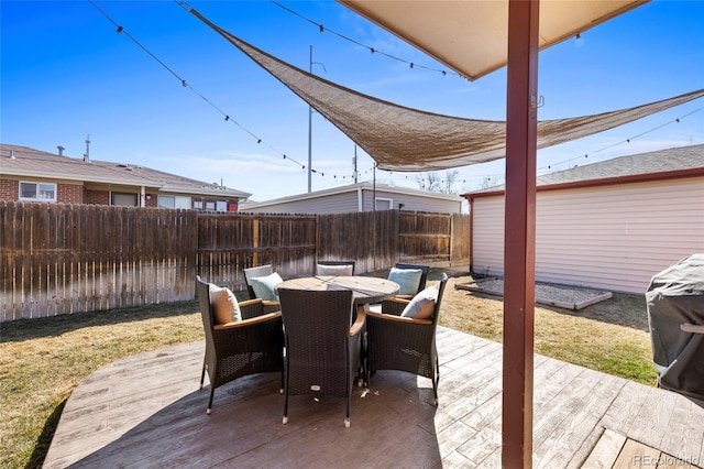 view of patio / terrace featuring a fenced backyard, a deck, and outdoor dining space