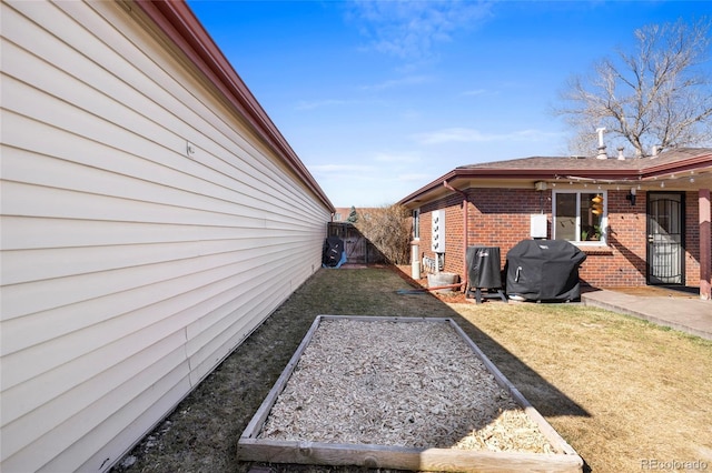 view of yard featuring a garden and fence