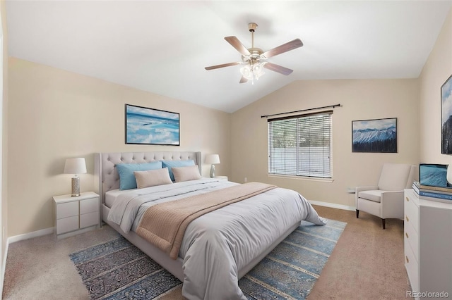 bedroom featuring baseboards, vaulted ceiling, and light carpet