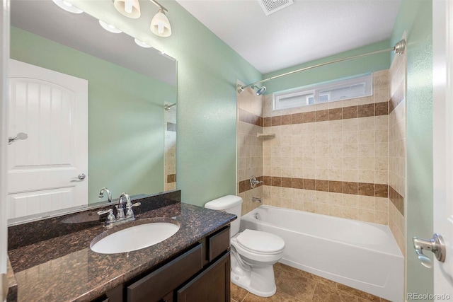 bathroom with washtub / shower combination, vanity, toilet, and visible vents