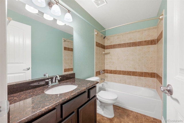 bathroom with vanity, toilet, bathing tub / shower combination, and visible vents