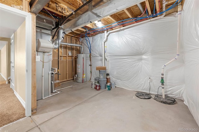 unfinished basement with heating unit and gas water heater